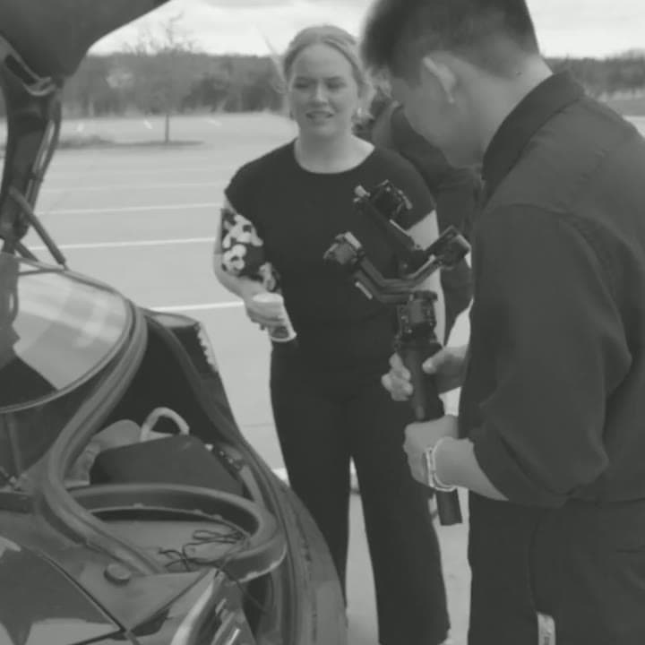Loading gear out of the trunk before a shoot