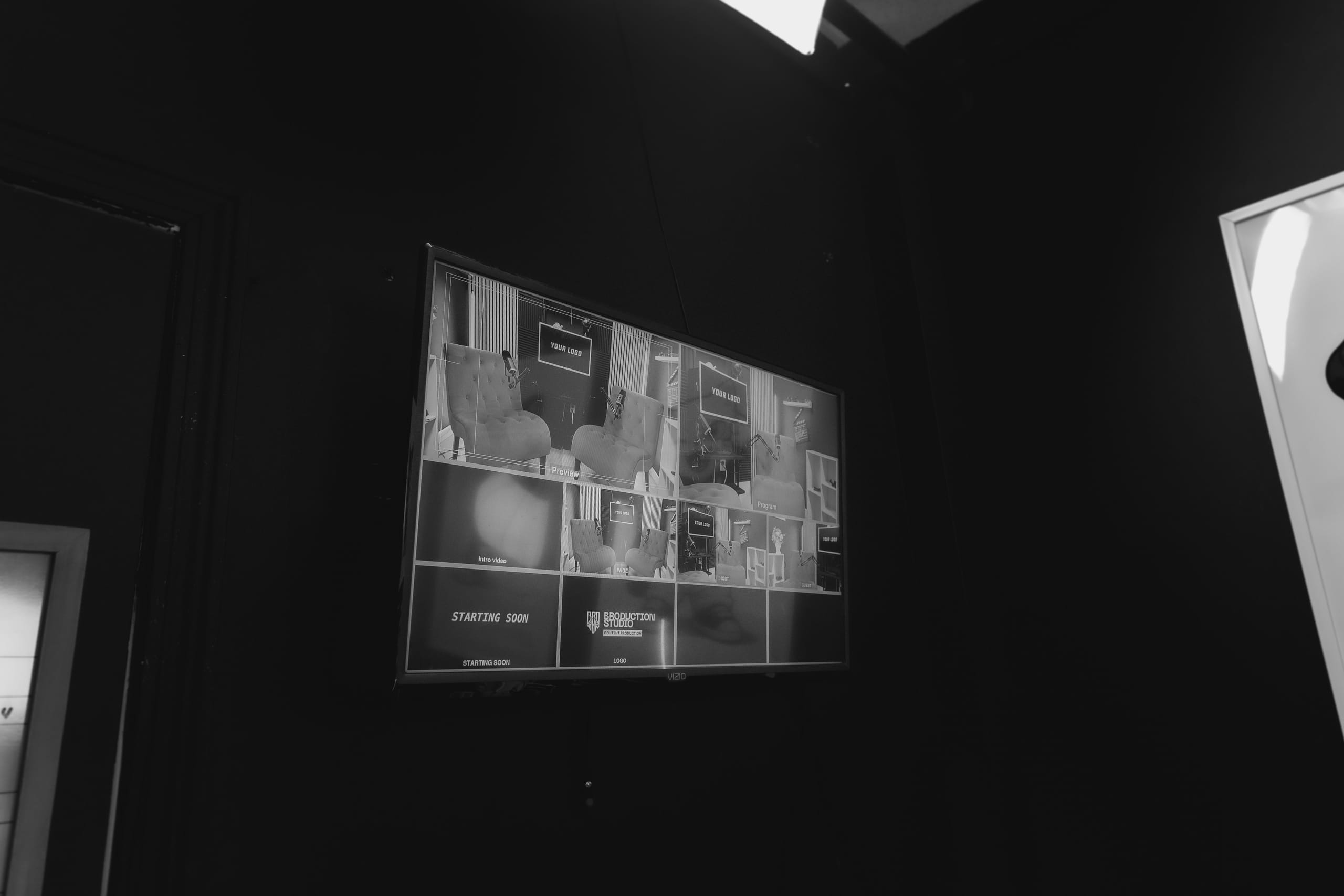 Cuts of an ad up on the studio monitor wall